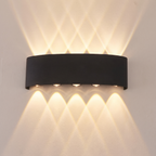 Aplique de pared LED bidireccional negro encendido arriba y abajo